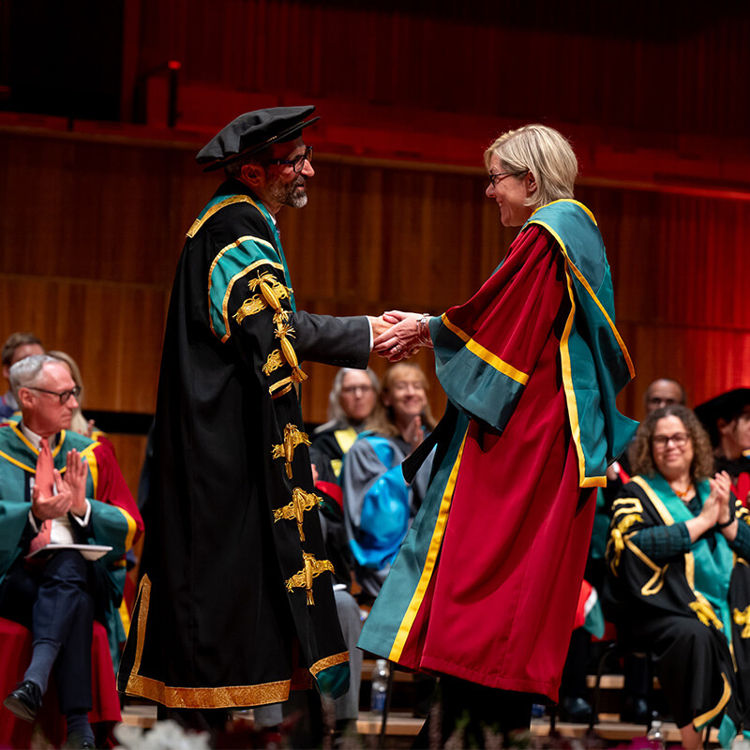 Students hugging at the Graduation ceremony