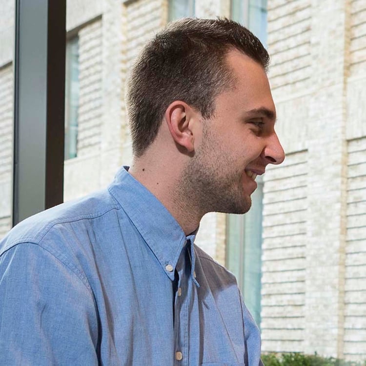 member of support staff smiling